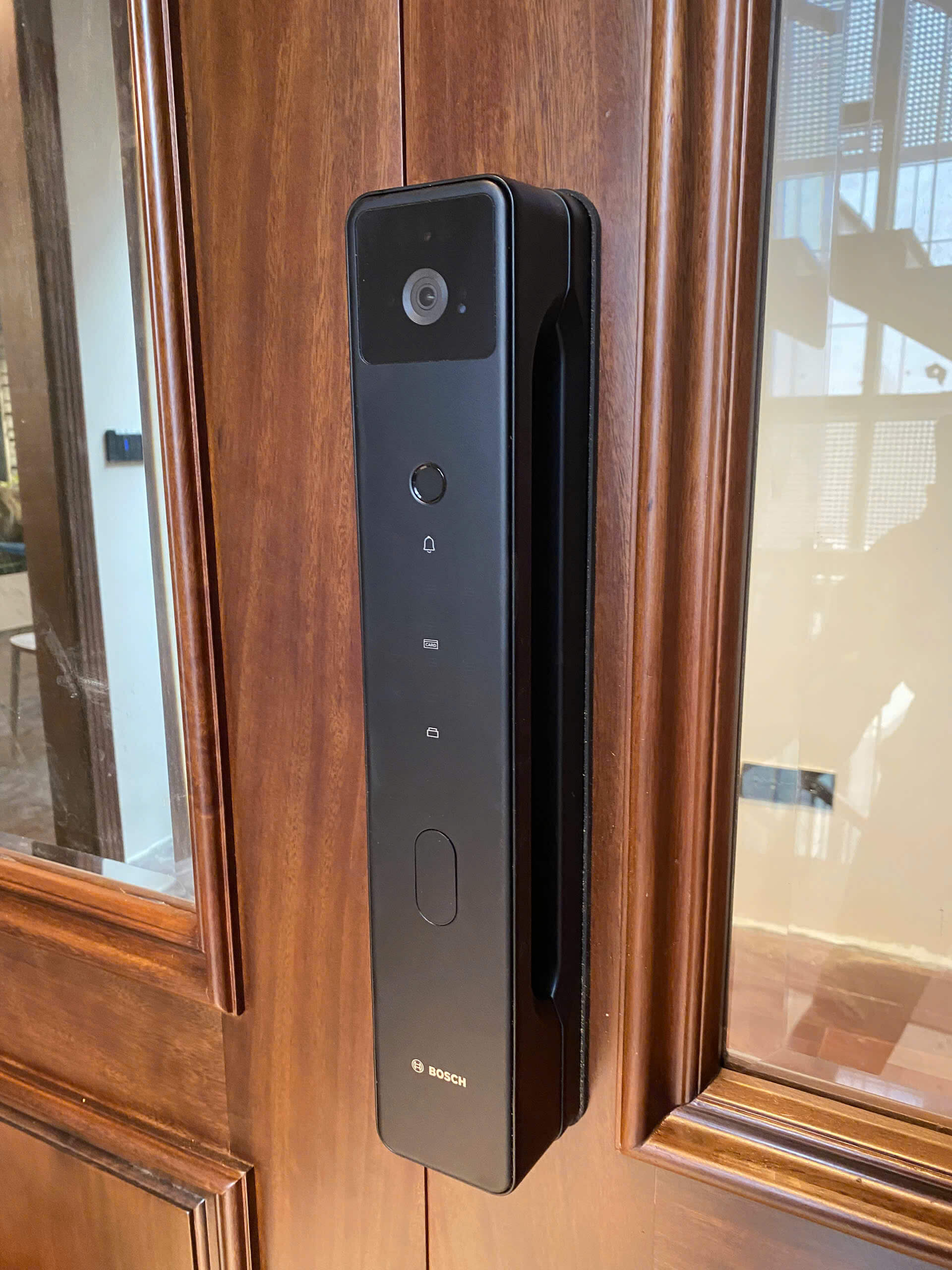 Bosch FU6 smart lock installed on a premium wooden entry door